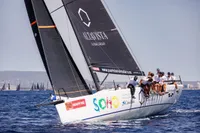 Sailing yacht TP52 from 2007 with crew racing on open water.