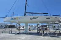 Sailboat TP52 from 2007 with sponsor logos, docked at Puerto Benalmádena.
