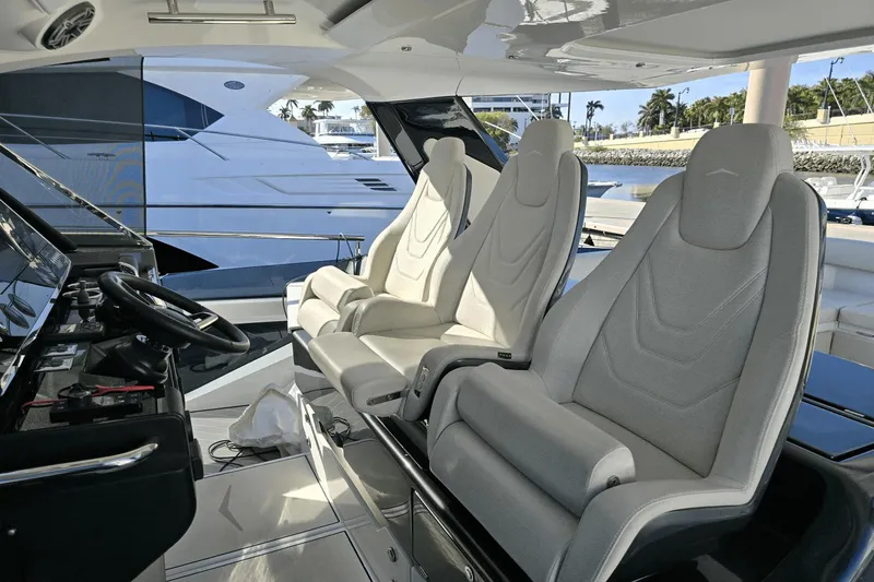 Making Memories II Yacht Photos Pics Interior of 2022 Azimut Verve 47 yacht with luxurious seating and modern helm.
