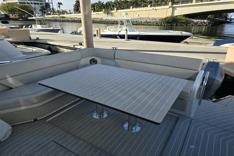 Making Memories II Yacht Photos Pics Azimut Verve 47 2022 yacht with outdoor seating and table at the dock.