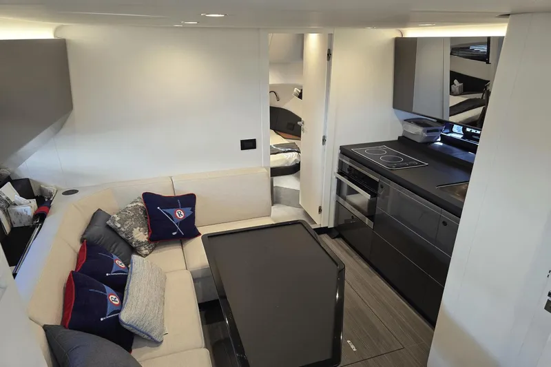 Making Memories II Yacht Photos Pics Interior of 2022 Azimut Verve 47 yacht with modern kitchen and cozy seating area.