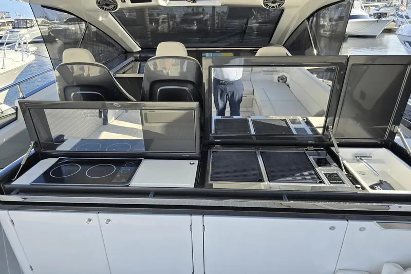 Making Memories II Yacht Photos Pics 2022 Azimut Verve 47 yacht with outdoor kitchen and seating area.