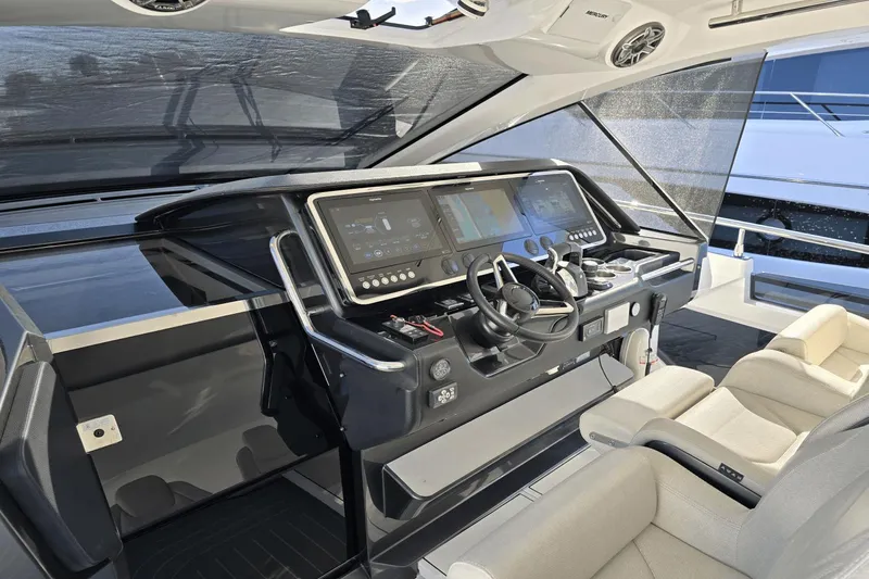 Making Memories II Yacht Photos Pics 2022 Azimut Verve 47 helm station with modern navigation equipment and comfortable seating.