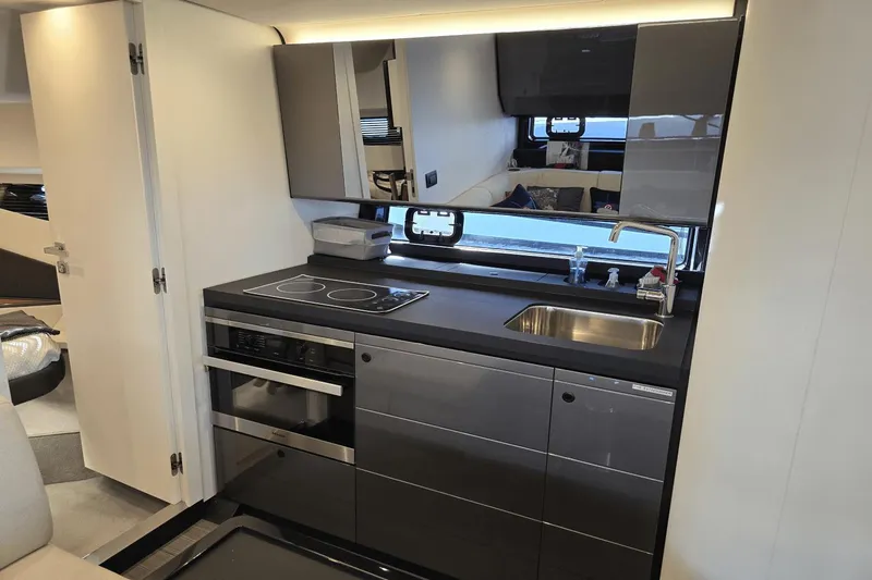 Making Memories II Yacht Photos Pics Modern kitchen area in 2022 Azimut Verve 47 yacht with sleek appliances.