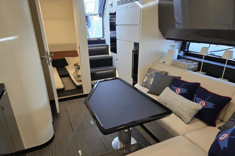 Making Memories II Yacht Photos Pics Interior of 2022 Azimut Verve 47 yacht with modern seating and table.