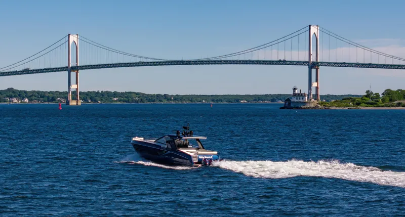 Making Memories II Yacht Photos Pics 2022 Azimut Verve 47 cruising near a suspension bridge on a sunny day.