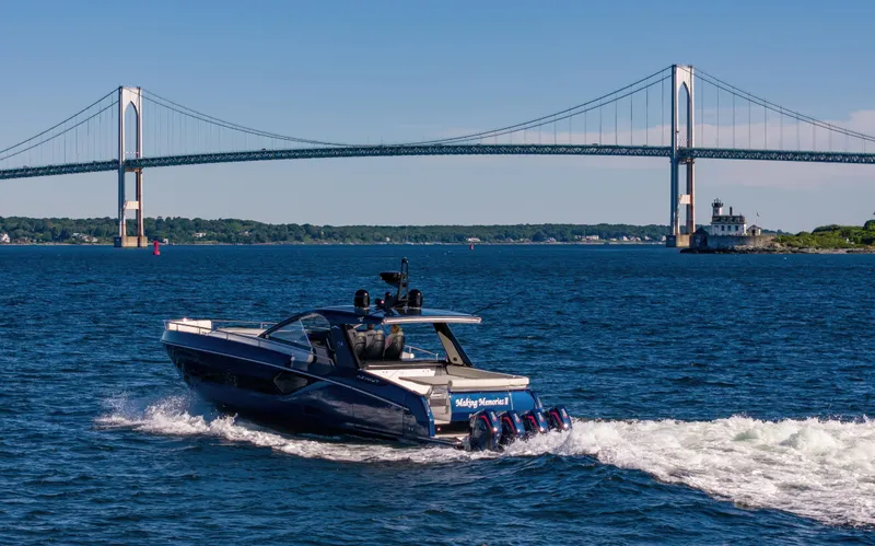 Making Memories II Yacht Photos Pics 2022 Azimut Verve 47 yacht cruising near a suspension bridge on a sunny day.