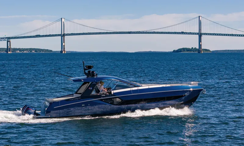 Making Memories II Yacht Photos Pics 2022 Azimut Verve 47 yacht cruising near a bridge on a sunny day.
