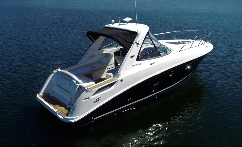  Yacht Photos Pics 2010 Sea Ray 310 Sundancer luxury motorboat on calm water.