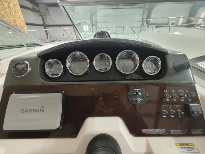  Yacht Photos Pics Control panel of a 2010 Sea Ray 310 Sundancer boat with Garmin navigation system.