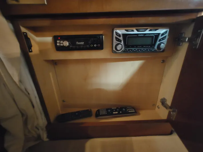  Yacht Photos Pics Stereo system and remotes in a 2010 Sea Ray 310 Sundancer boat cabinet.
