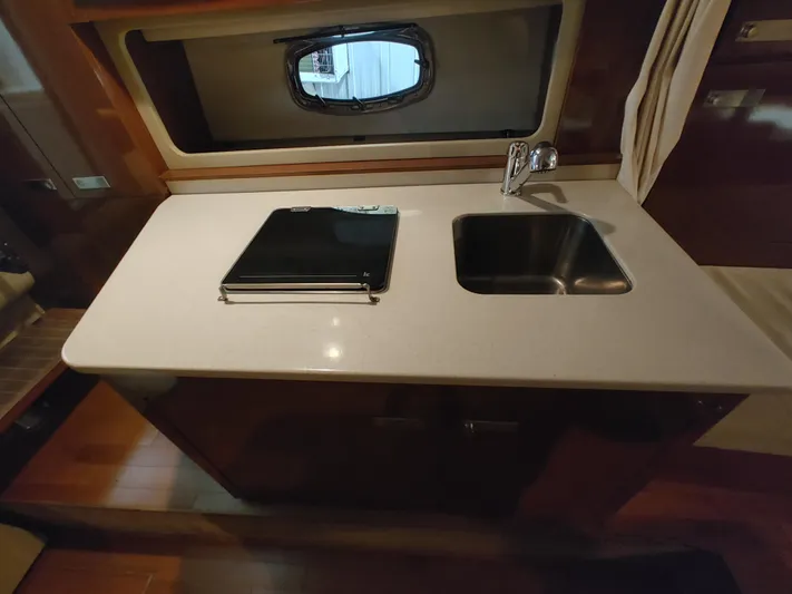  Yacht Photos Pics Sea Ray 310 Sundancer 2010 galley with sink and stove.