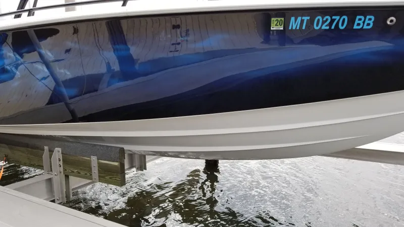  Yacht Photos Pics 2014 Concept 36' CC boat on lift, displaying registration MT 0270 BB.