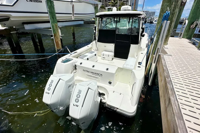 Extra Vagancia Yacht Photos Pics 2015 Boston Whaler 315 Conquest docked, featuring twin Mercury 300 V8 engines.