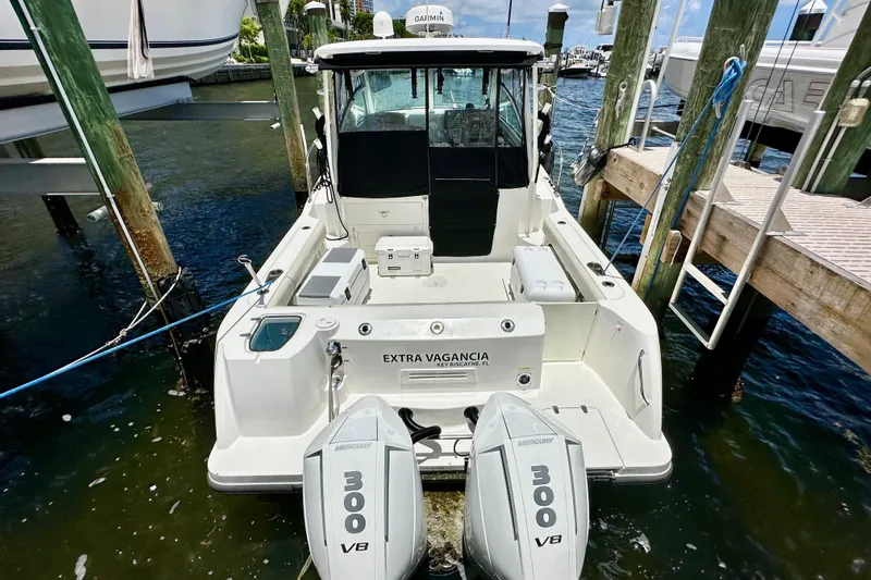 Extra Vagancia Yacht Photos Pics 2015 Boston Whaler 315 Conquest docked, featuring twin Mercury 300 V8 engines.