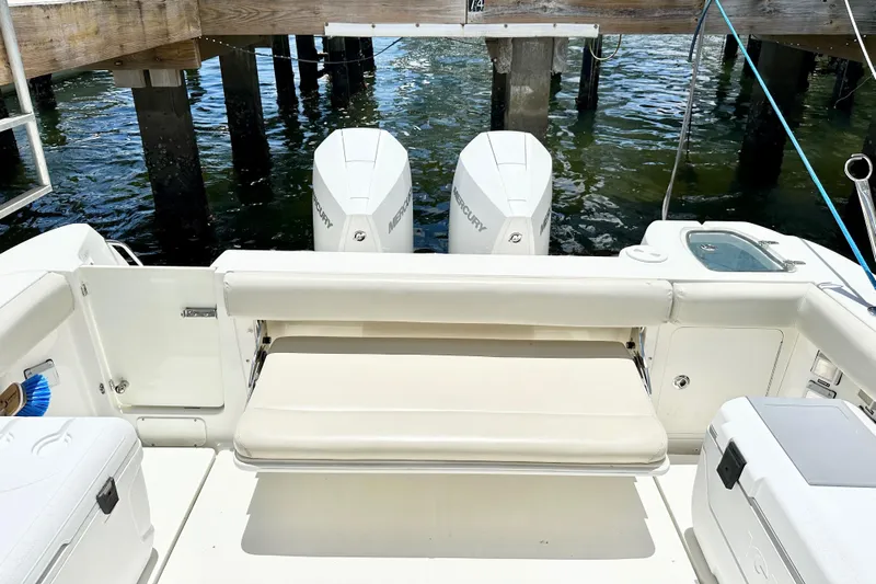 Extra Vagancia Yacht Photos Pics 2015 Boston Whaler 315 Conquest boat with twin Mercury engines at dock.
