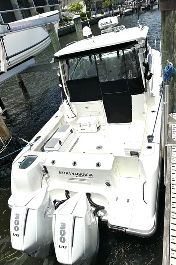 Extra Vagancia Yacht Photos Pics 2015 Boston Whaler 315 Conquest boat docked with twin 300 V8 engines.
