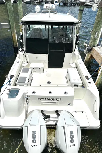 Extra Vagancia Yacht Photos Pics 2015 Boston Whaler 315 Conquest boat docked with twin Mercury 300 V8 engines.