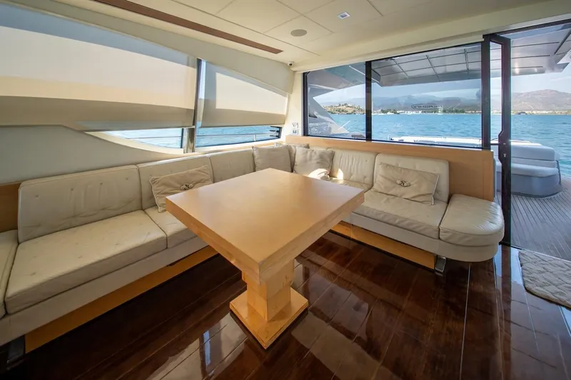Freedom 2 Yacht Photos Pics Luxurious interior of 2010 Pershing 72 yacht with elegant seating and scenic ocean view.