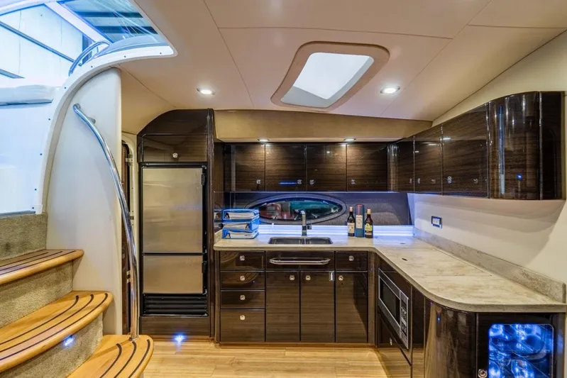 Beautiful Now Yacht Photos Pics Luxurious interior of 2015 Formula 45 Yacht with modern kitchen and elegant wood finishes.