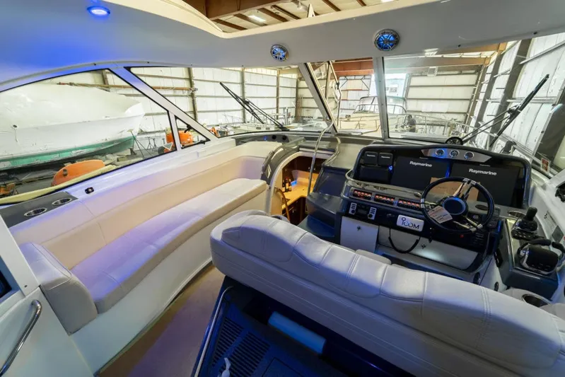 Beautiful Now Yacht Photos Pics Interior of a 2015 Formula 45 Yacht with modern helm and seating area.