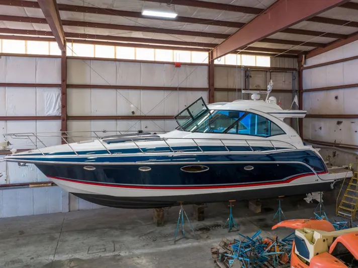 Beautiful Now Yacht Photos Pics 2015 Formula 45 Yacht in storage, blue and white exterior, indoor facility.