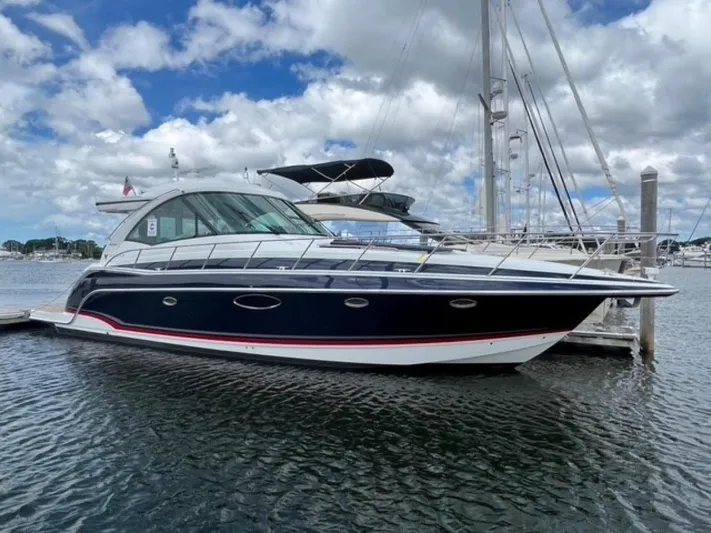 Beautiful Now Yacht Photos Pics 2015 Formula 45 Yacht docked under a partly cloudy sky.