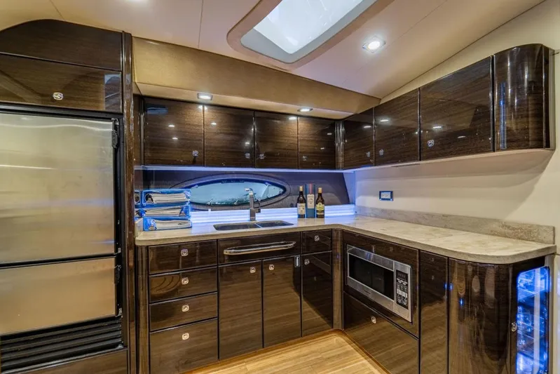 Beautiful Now Yacht Photos Pics Luxurious kitchen interior of 2015 Formula 45 Yacht with modern appliances and sleek cabinetry.