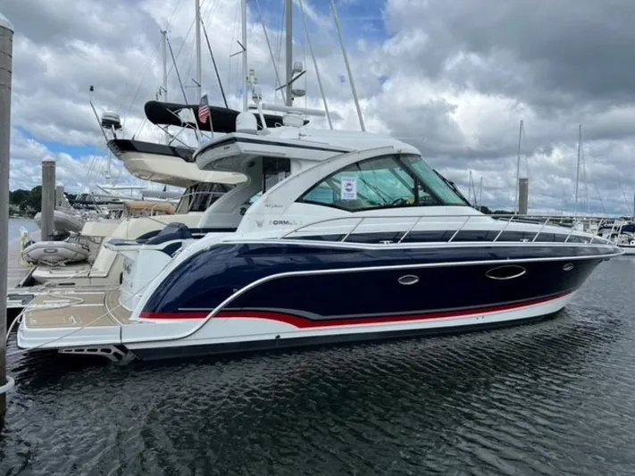 Beautiful Now Yacht Photos Pics 2015 Formula 45 Yacht docked at marina under cloudy sky.