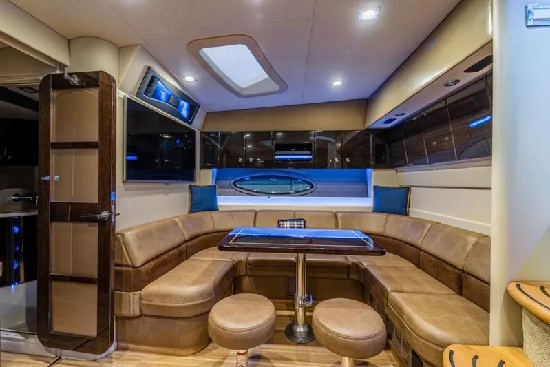 Beautiful Now Yacht Photos Pics Luxurious interior of 2015 Formula 45 Yacht with plush seating and elegant table.