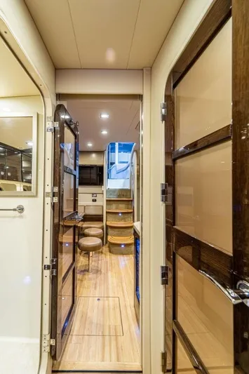 Beautiful Now Yacht Photos Pics Interior view of a 2015 Formula 45 Yacht, featuring elegant wood finishes and modern design.