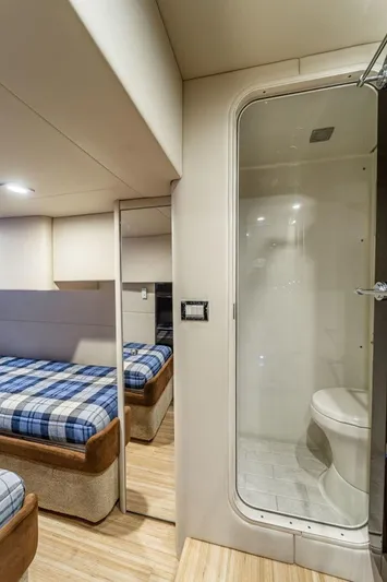 Beautiful Now Yacht Photos Pics Interior of 2015 Formula 45 Yacht featuring bedroom and bathroom with modern amenities.