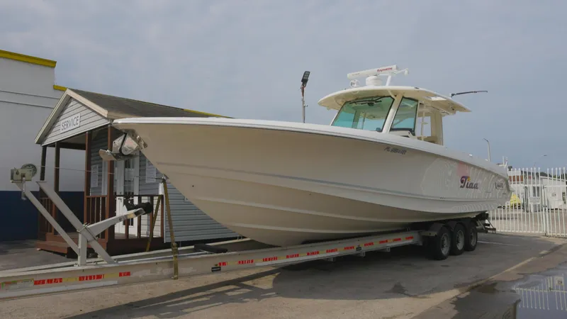  Yacht Photos Pics 2018 Boston Whaler 380 Outrage boat on trailer at marina.