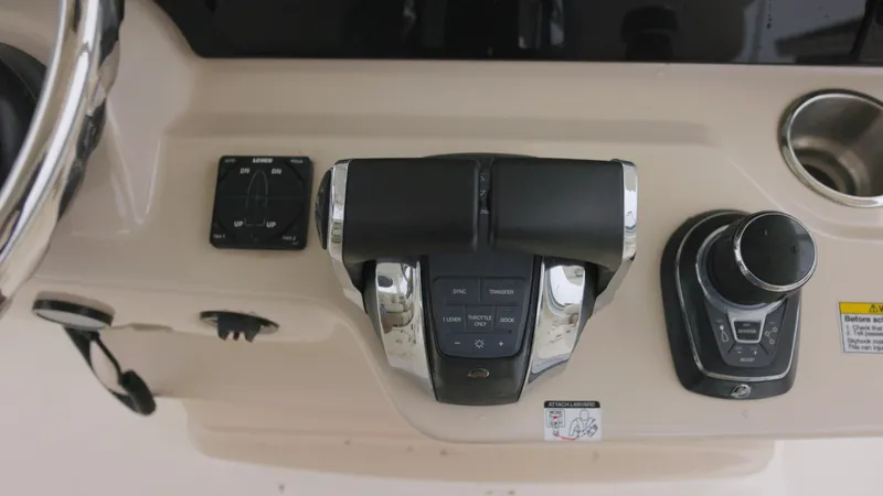  Yacht Photos Pics Control panel of a 2018 Boston Whaler 380 Outrage boat, featuring throttle and joystick.