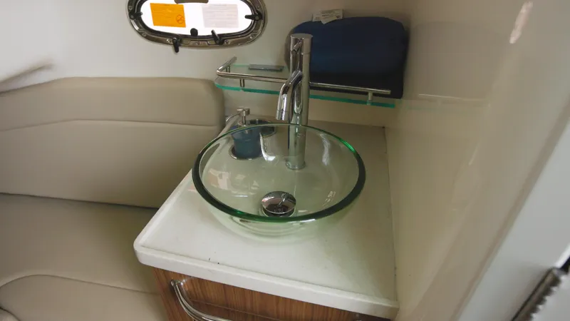  Yacht Photos Pics 2018 Boston Whaler 380 Outrage interior with modern glass sink and seating area.