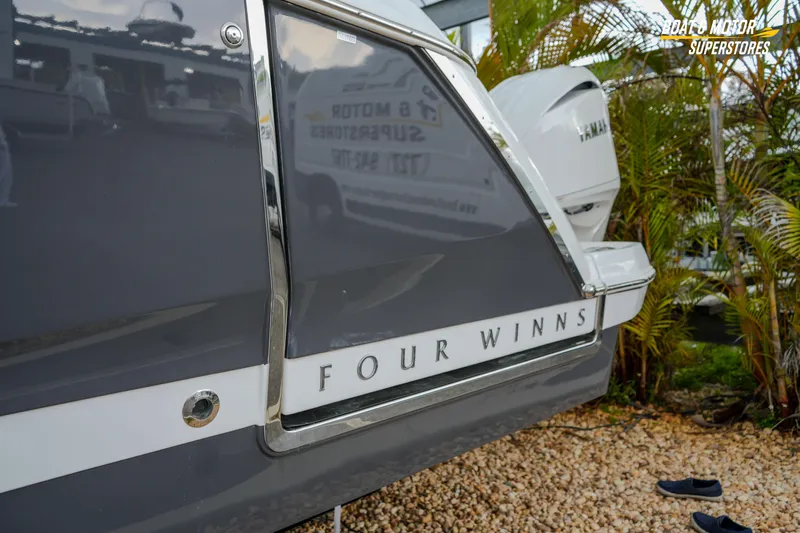  Yacht Photos Pics 2026 Four Winns H9 OB boat detail with sleek design and branding.