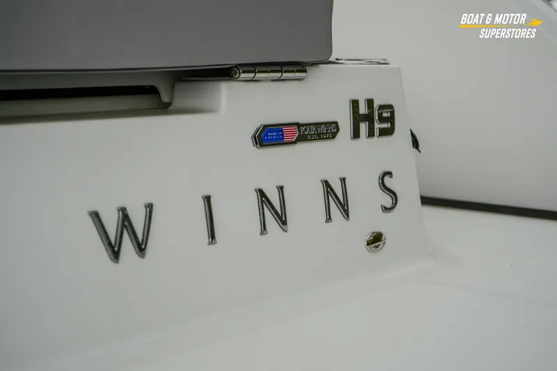  Yacht Photos Pics 2026 Four Winns H9 OB boat branding detail with logo and model name.