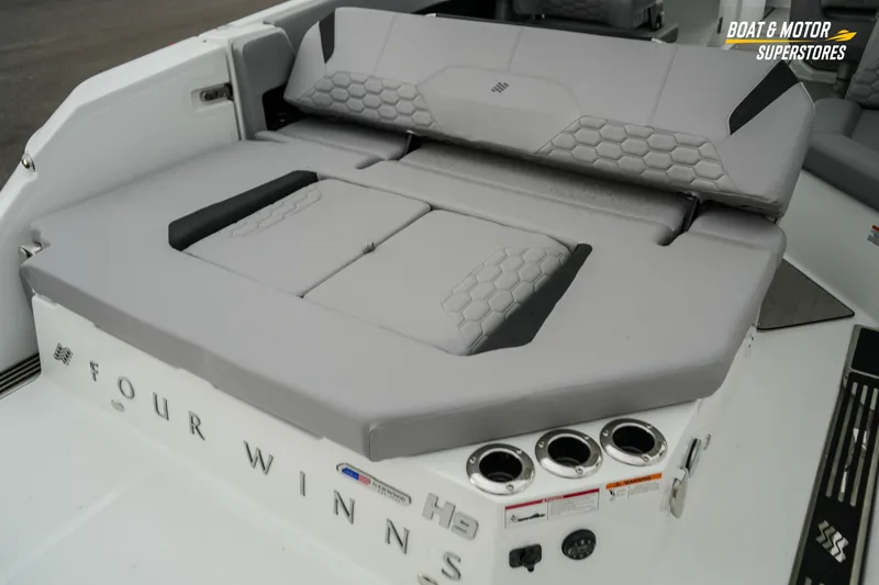  Yacht Photos Pics 2026 Four Winns H9 OB boat with gray seating and cup holders.