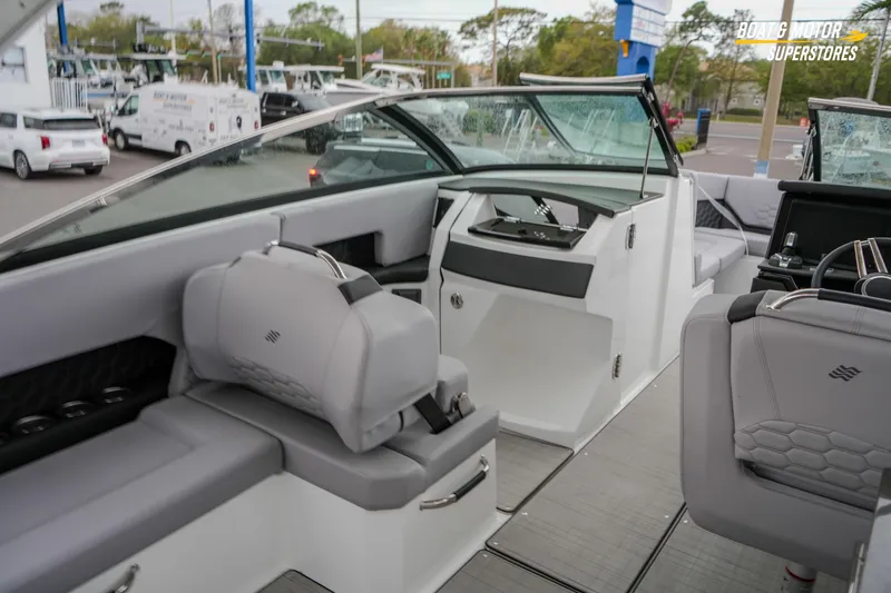  Yacht Photos Pics 2026 Four Winns H9 OB boat interior with modern seating and sleek dashboard design.