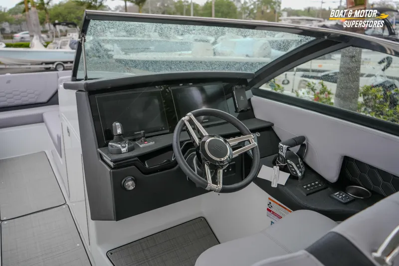  Yacht Photos Pics 2026 Four Winns H9 OB boat cockpit with modern steering and controls.