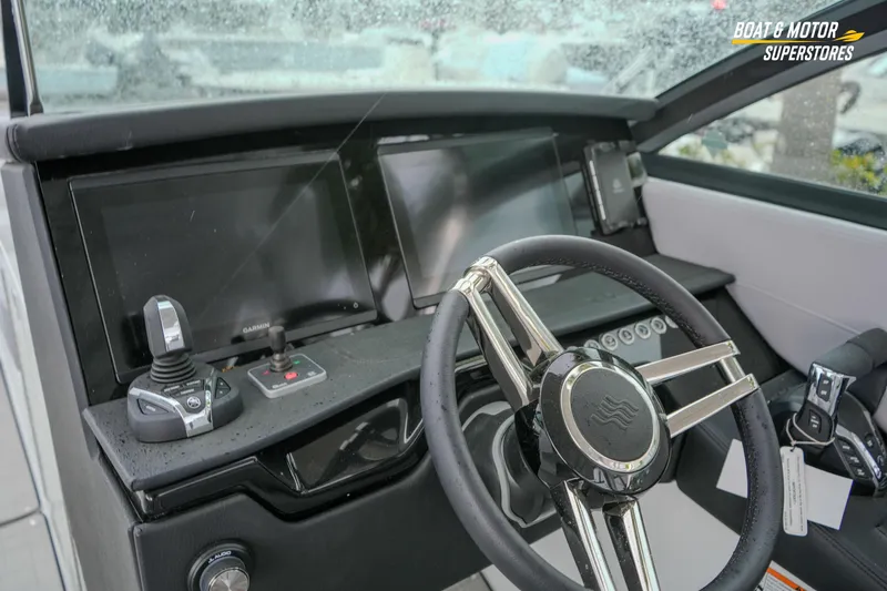  Yacht Photos Pics 2026 Four Winns H9 OB boat dashboard with modern controls and steering wheel.