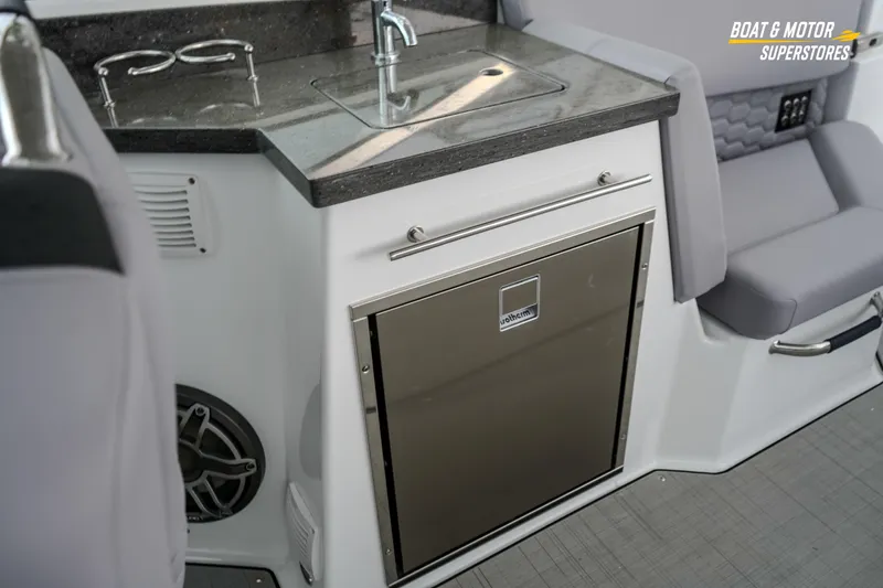  Yacht Photos Pics 2026 Four Winns H9 OB boat interior with kitchenette and seating area.