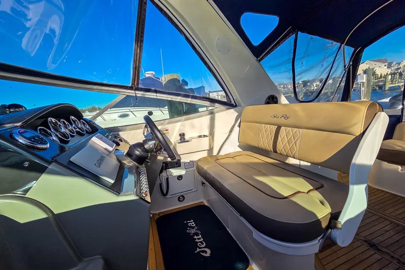 Yacht Photos Pics Interior of 2015 Sea Ray 310 Sundancer boat with helm and seating area.