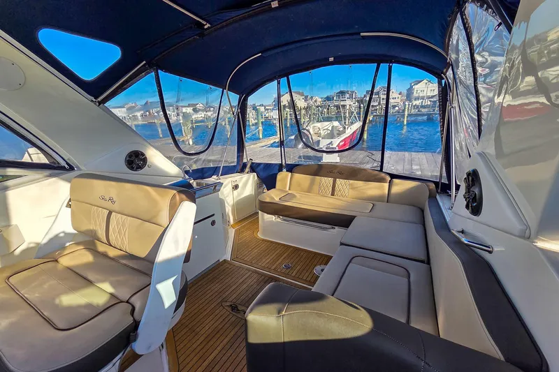  Yacht Photos Pics Interior of 2015 Sea Ray 310 Sundancer yacht with luxurious seating and marina view.