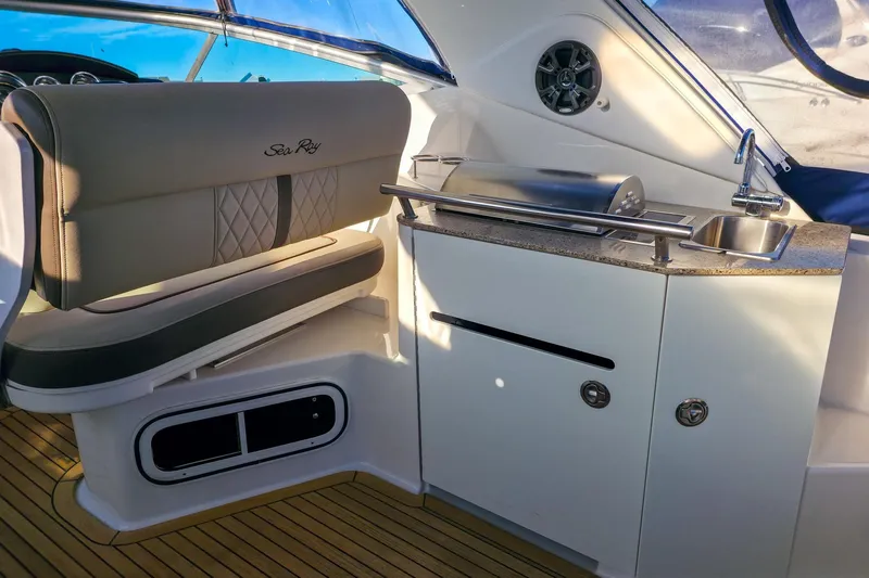  Yacht Photos Pics Interior of 2015 Sea Ray 310 Sundancer with seating, sink, and grill.