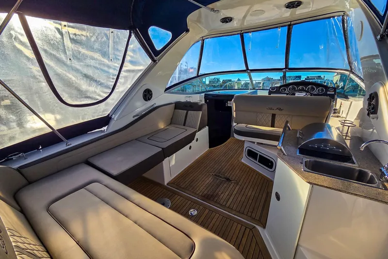  Yacht Photos Pics Luxurious interior of 2015 Sea Ray 310 Sundancer yacht with plush seating and modern amenities.