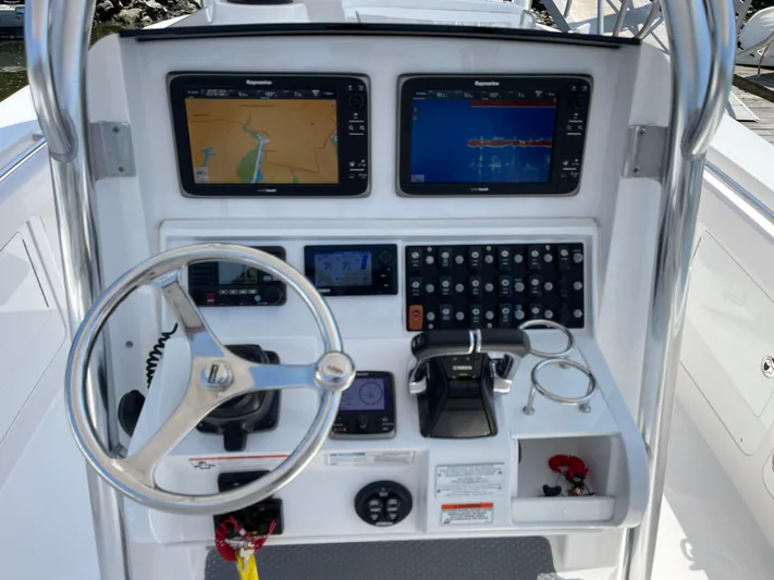  Yacht Photos Pics 2014 Southport 27 Center Console boat dashboard with navigation screens and controls.