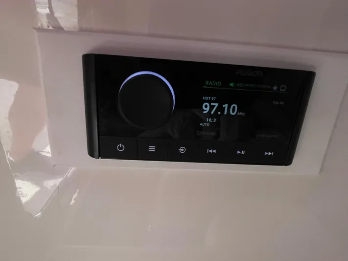  Yacht Photos Pics Boat stereo system displaying radio station 97.10 FM on a 2014 Southport 27 Center Console.