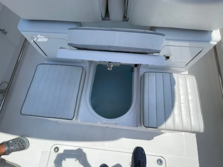  Yacht Photos Pics 2014 Southport 27 Center Console boat interior with seating and storage compartments.
