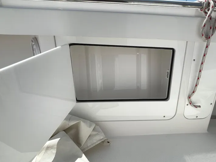  Yacht Photos Pics Open storage compartment on a 2014 Southport 27 Center Console boat.